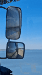 Morning drive past calm waters near Chaikovsky, Russia