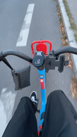 First-person electric scooter ride through Paris streets