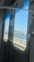 Early morning train journey captured crossing bridge in Seoul