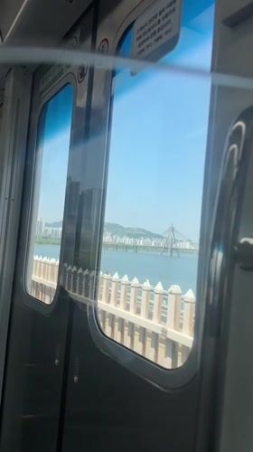 Early morning train journey captured crossing bridge in Seoul