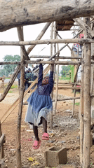 Children play and eat outdoors in rural Nigeria