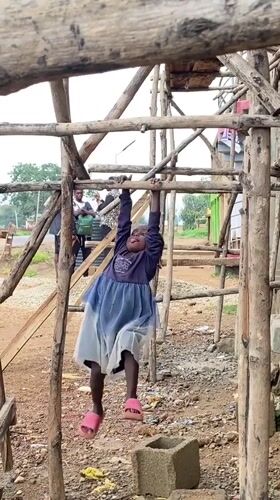 Children play and eat outdoors in rural Nigeria