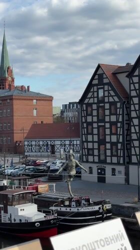 Afternoon street life and busking captured in Bydgoszcz, Poland