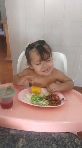 Child's dinnertime and caged birds observed in Caracas apartments