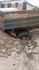 Dump truck sinks into ground, spilling load at Ilado lot
