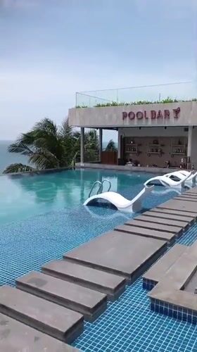 Resort guests enjoy early morning poolside activities in Mui Ne