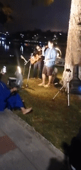 Evening lakeside gathering with live music in Da Lat park