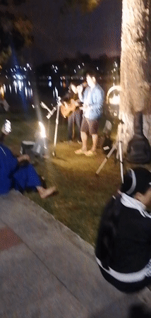 Evening lakeside gathering with live music in Da Lat park