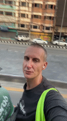 Tourist films selfie video on motorcycle in Chiang Mai