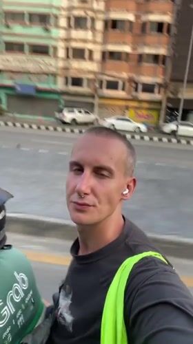 Tourist films selfie video on motorcycle in Chiang Mai