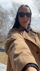 Woman takes selfies outdoors in Chaikovsky, Russia