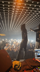 Late-night concert performance featuring DJ and performers in Paris