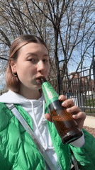 Moscow residents enjoy sunny spring day with beverages, strollers