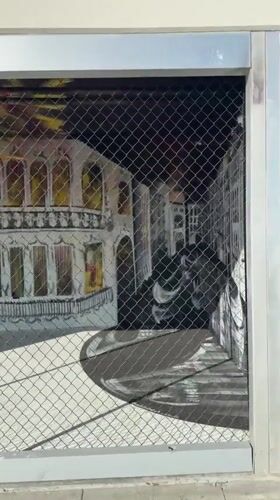 Fenced outdoor art installation documented in Los Angeles
