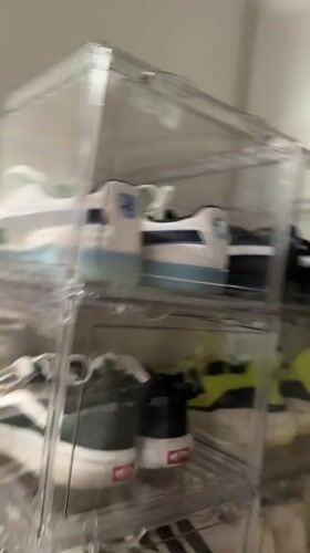 Organized shoe collection displayed in clear storage unit