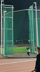 Discus thrower practices at Santiago stadium Friday evening