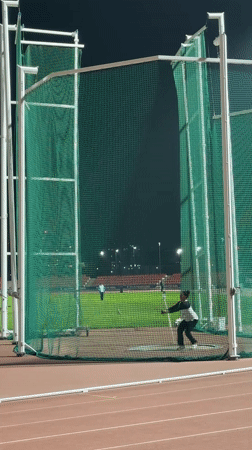 Discus thrower practices at Santiago stadium Friday evening