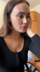 Woman speaks to screen in Surgut apartment setting