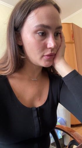 Woman speaks to screen in Surgut apartment setting