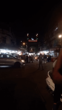 Mumbai religious district bustling with evening activity