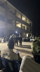 Traditional performance captured at nighttime gathering in Maiduguri, Nigeria