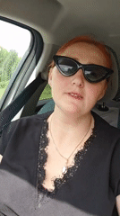 Woman in sunglasses observed in vehicle passenger seat, Chaikovsky