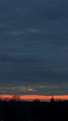 Dramatic sunset clouds captured with silhouetted communications tower