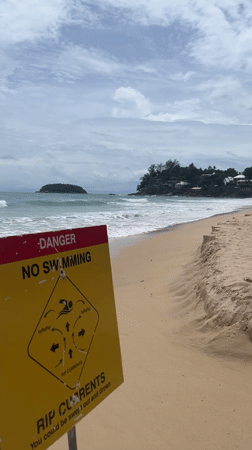 Beach safety sign warns of rip currents in Karon