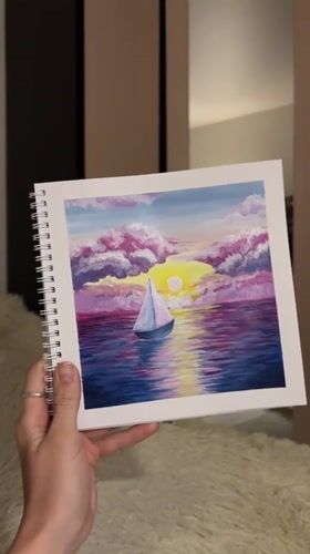 Artist creates sunset sailboat paintings in Perm studio session