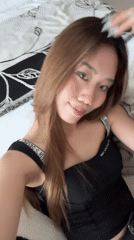 Woman takes morning mirror selfies in Chongqing bedroom
