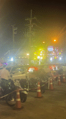 Organized street scene with motorcycles, cones near Central Phuket