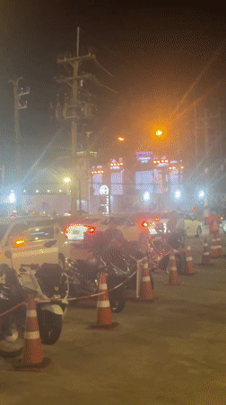 Organized street scene with motorcycles, cones near Central Phuket