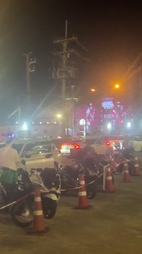 Organized street scene with motorcycles, cones near Central Phuket