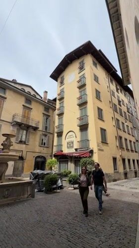 Sunday morning street life captured across historic Bergamo