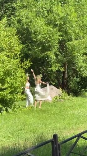White dresses and flower crowns mark Midsummer in Moscow park