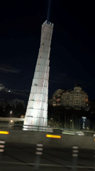 Illuminated Monument Displays Shifting Colors in Tbilisi Evening