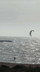Kite surfers ride waves off Israeli coast near Hof HaCarmel