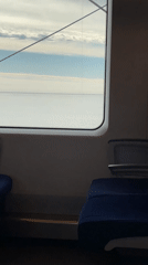 Train passenger views gray water from window in Russia