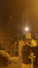 Late-night street gathering captured across Barcelona city center