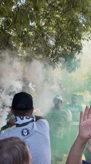 LECA FC supporters celebrate with green smoke in Oeiras