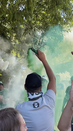 LECA FC supporters celebrate with green smoke in Oeiras