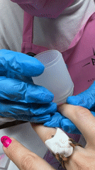 Nail technician performs manicure service in Vladimir, Russia