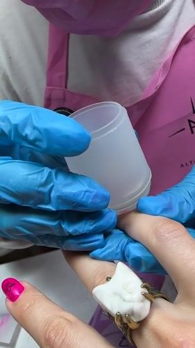Nail technician performs manicure service in Vladimir, Russia