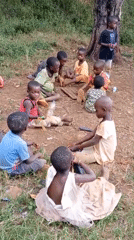 Children play soccer, sort clothes in rural Congo village