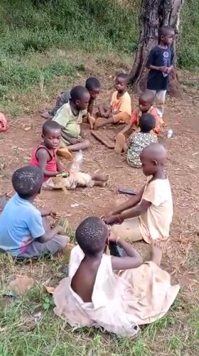 Children play soccer, sort clothes in rural Congo village