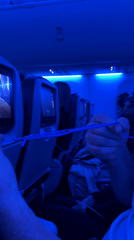 Nighttime flight cabin scenes captured near Naples