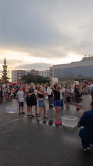 Kids line up for an ice bucket challenge in a Russian schoolyard