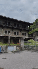 Tourist documents scenic walk through Biasca's gardens and streets