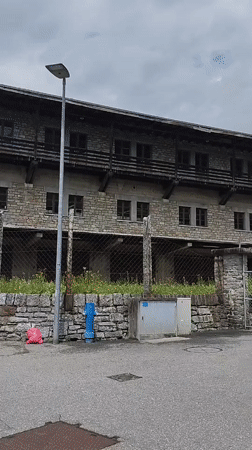 Tourist documents scenic walk through Biasca's gardens and streets