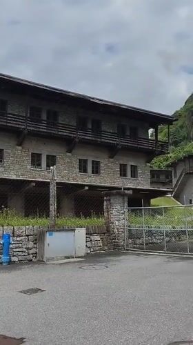 Tourist documents scenic walk through Biasca's gardens and streets